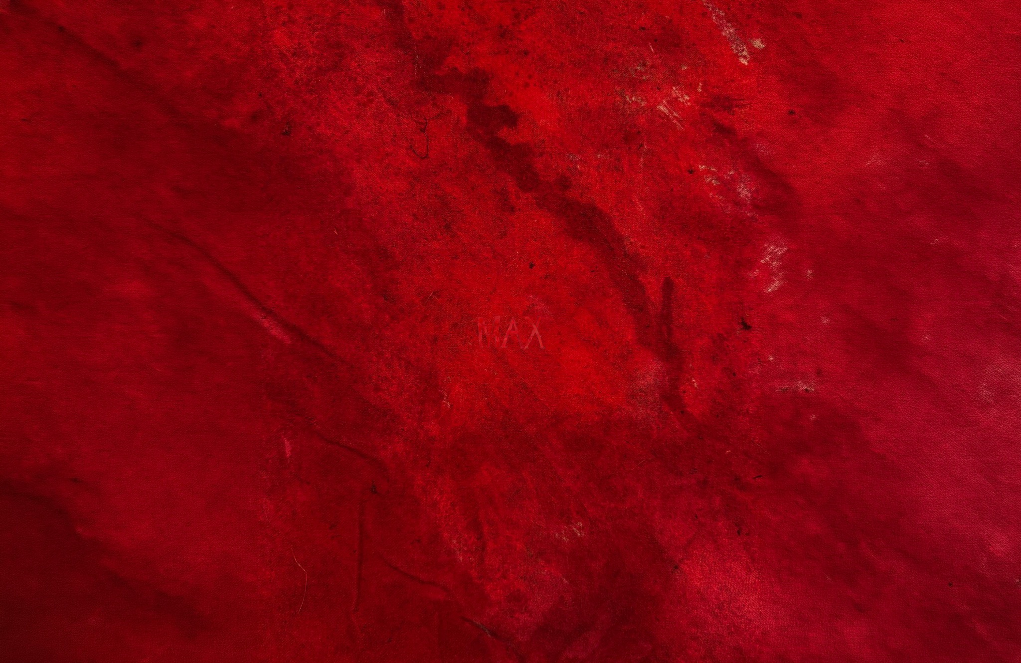 Red textile cover marked MAX